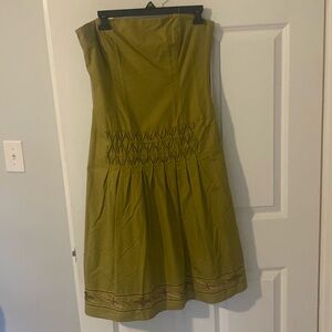 beautiful strapless dress with pleated back and beaded bottom.